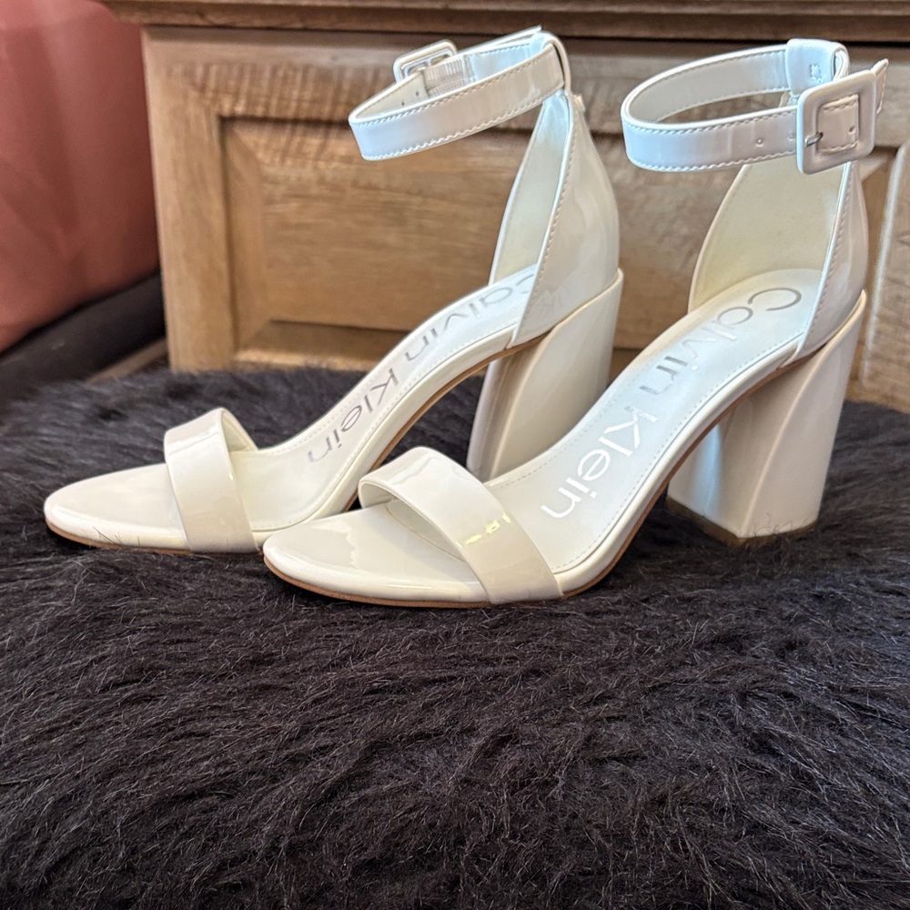 Calvin Klein Women's patent leather Cream heeled sandal with ankle strap